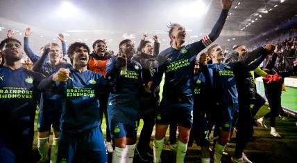 PSV players celebrate their 0-8 victory over SC Heerenveen in Friesland, 25 April 2024