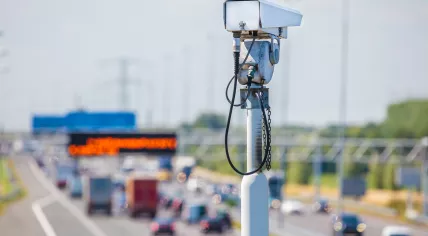 Surveillance camera in front of a Dutch highway with traffic