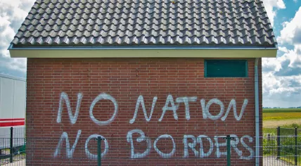 No Nation No Borders, graffiti on a utilitarian building in Lauwersoog, the Netherlands