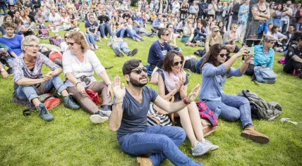 Attendees of a festival in Vondelpark in Amsterdam