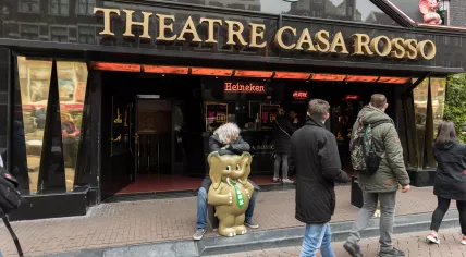Jan Otten straddling the elephant in front of live sex theater Casa Rosso in Amsterdam's Red Ligth District, 20 April 2017