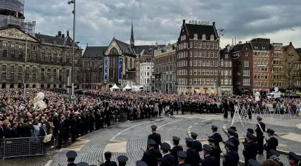 King Willem-Alexander and Queen Maxima are handed a wreath to place at the National Monument on Dam Square during the Remembrance Day ceremony in Amsterdam. 4 May 2024