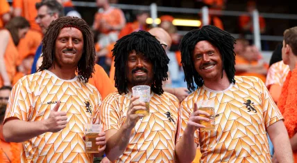 Oranje fans in blackface dressed as Ruud Gullit at the Poland vs Netherlands European Championship match in Hamburg, 16 June 2024