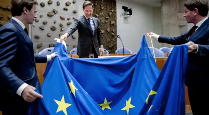 Outgoing Prime Minister Mark Rutte receives a European flag from Laurens Dassen (Volt) and Jan Paternotte (D66) prior to the European summit of June 27 and 28, 2024.
