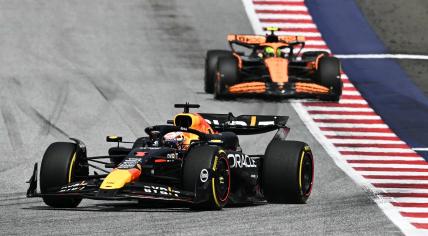 Red Bull Racing's Dutch driver Max Verstappen (front) drives ahead of McLaren's British driver Lando Norris during the Formula One Austrian Grand Prix on the Red Bull Ring race track in Spielberg, Austria, on June 30, 2024. 