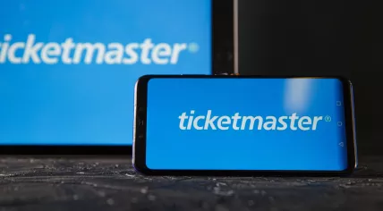 A phone and tablet displaying the Ticketmaster logo.