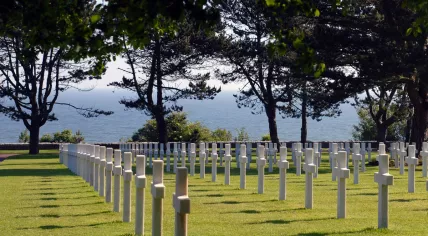 Rows of white crosses in the Normandy American Cemetery and Memorial