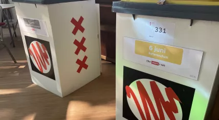 Ballot boxes in an Amsterdam polling station on 6 June 2024. The red one is for the European Parliament election, the yellow for a referendum on the city's green spaces