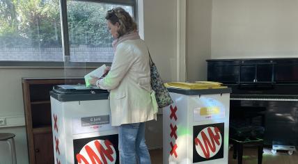 A woman casts a ballot in Amsterdam during the 2024 European Parliament election. 6 June 2024