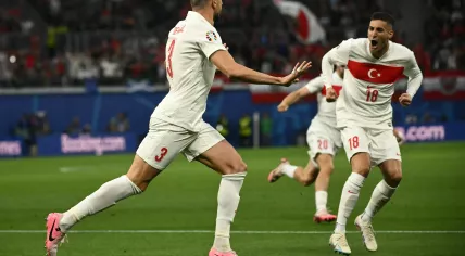 Turkey's defender #03 Merih Demiral (L) celebrates with teammates after scoring his team's first goal during the UEFA Euro 2024 round of 16 football match between Austria and Turkey at the Leipzig Stadium in Leipzig on July 2, 2024. 