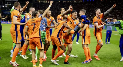 The players of the Dutch national team dance after the 2-1 victory over Turkey during the UEFA EURO 2024 quarter-final match between the Netherlands and Turkey at the Olympiastadion on July 6, 2024 in Berlin, Germany