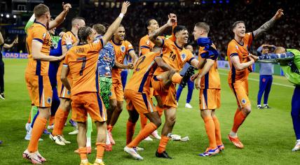 The players of the Dutch national team dance after the 2-1 victory over Turkey during the UEFA EURO 2024 quarter-final match between the Netherlands and Turkey at the Olympiastadion on July 6, 2024 in Berlin, Germany