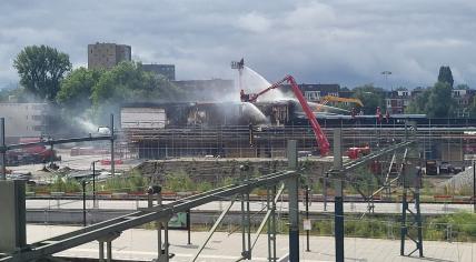 The fire department fighting a fire at the renovations happening around Groningen station, 17 July 2024