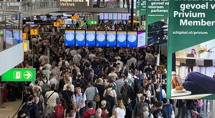 Schiphol Airport crowded with travelers as global Windows outage cancels or delays every single flight, 19 July 2024