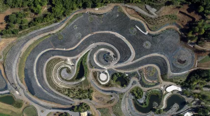 This photo taken by a drone shows an aerial view of a nature park shaped after Vincent van Gogh's painting "The Starry Night" near Visoko, Bosnia, Sunday, Sept. 17, 2023.