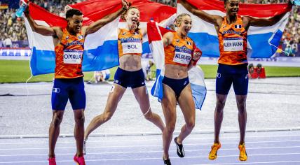 Femke Bol, Lieke Klaver, Eugene Omalla, Isaya Klein Ikkink celebrate their gold medal in the 4 x 400m mixed relay during the Olympic athletics competitions in Stade de France.