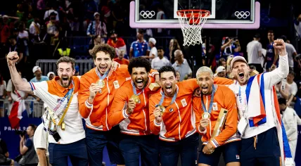 Jan Driessen, Dimeo van der Horst, Arvin Slagter and Worthy de Jong with the gold medals during the medal ceremony of the 3x3 basketball final between the Netherlands and France at the Place de la Concorde during the Olympic Games.