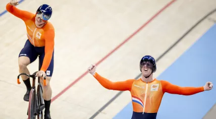 Track cyclists Roy van den Berg, Harrie Lavreysen and Jeffrey Hoogland win a gold medal during the team sprint final at the Olympic Games.