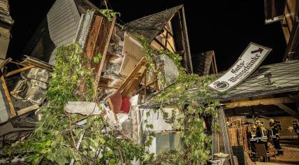 Debris are seen after the collapse of a hotel in Kroev, Germany, 7 August 2024