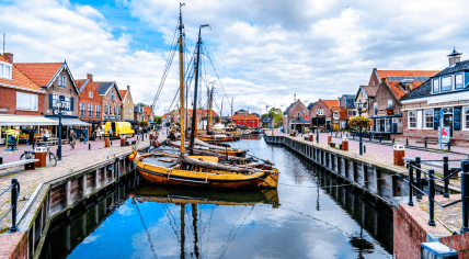 Traditional Wooden Fishing Boats, called Botters, moored in the harbor of the historic fishing village of Bunschoten-Spakenburg in the Netherlands