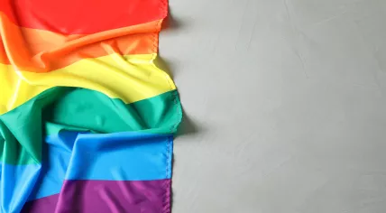 Rainbow gay flag on grey background