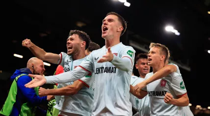 Daan Rots 11 of FC Twente celebrates a goal by Sam Lammers 10 of FC Twente to make it 1-1 during the Europa League match between Manchester United and FC Twente at Old Trafford, Manchester, England on 25 September 2024. 