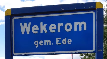 A sign marking the entrance to the village of Wekerom, in Ede, Gelderland. 21 September 2022