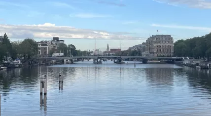 Looking north on the Amstel River in Amsterdam towards the Torontobrug, Amstel Hotel, with the Magerebrug and Zuiderkerk in the distance. 9 September 2024