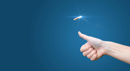 A light-skinned hand tossing a coin on a blue background