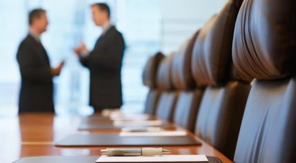 Businessmen talking in conference room