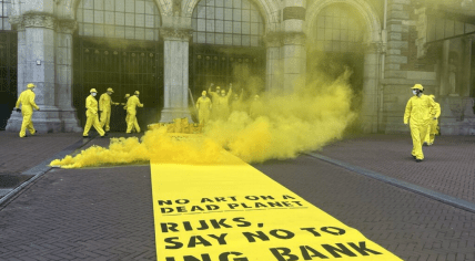 Extinction Rebellion activists protest in front of the Rijksmuseum in Amsterdam.