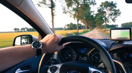 A driver behind the wheel of a Ford
