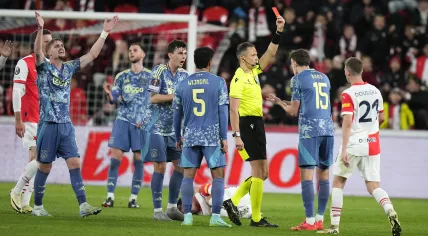 Ajax's Youri Baas,2nd right, sees a red card during the Europa League soccer match between Slavia and Ajax at the Eden Arena, in Prague, Czech Republic, Thursday, Oct. 3, 2024