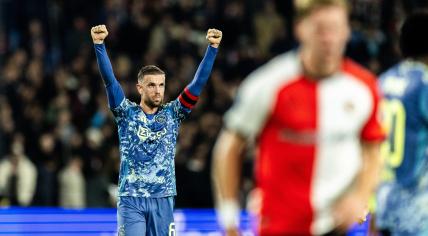 Jordan Henderson of Ajax (l) celebrates after winning 0-2 during the Dutch Eredivisie match between Feyenoord and Ajax at Feyenoord Stadion de Kuip on October 30, 2024 in Rotterdam, Netherlands.