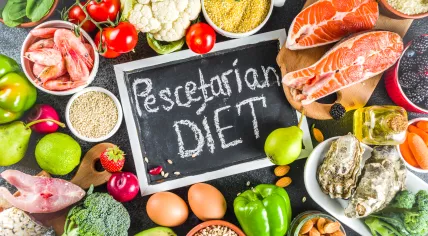A collection of fish, vegetables, nuts and grains as part of a pescetarian diet. 2019