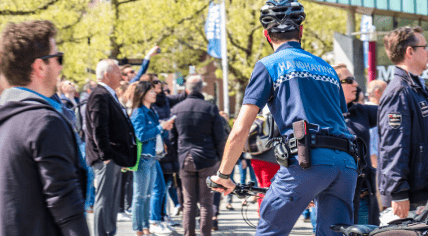 An enforcement officer in a crowd in Amsterdam