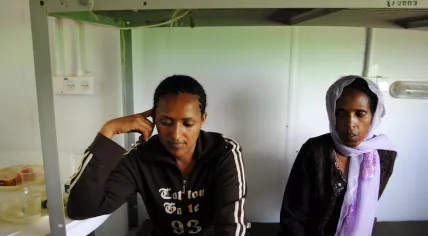 Two women at an asylum reception center