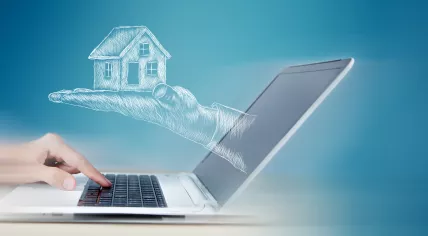 As a computer user searches for housing, a drawn hand presents a house from laptop