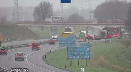 Traffic builds up behind an accident on the A29 toward Rotterdam on a gray and wet morning, 25 November 2024