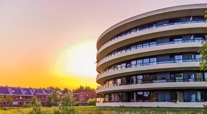Modern apartments building during sunset in Apeldoorn city