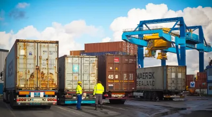 Stock image of workers at the Neuss Trimodal terminal along the Rijn River outside Dusseldorf, Germany