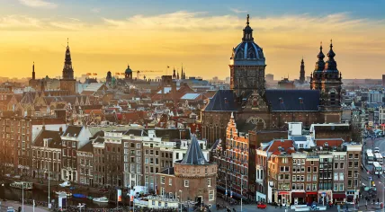 Amsterdam's skyline at sunset