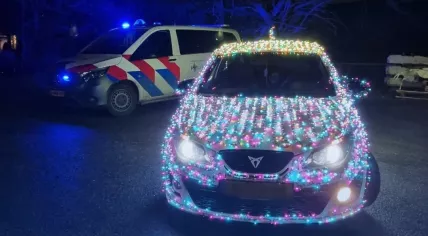 Image of car covered in Christmas lights on December 17, 2024.
