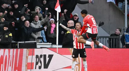 Noa Lang of PSV Eindhoven, Ryan Flamingo of PSV Eindhoven celebrate the 1-0 during the Dutch Eredivisie match between PSV Eindhoven and Feyenoord Rotterdam at Phillips Stadium on December 22, 2024 in Eindhoven, Netherlands.