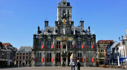 Tourists on the Delft town hall square.