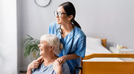 Caregiver with a woman at a nursing home
