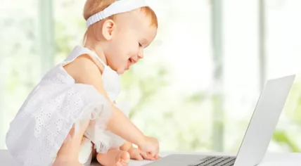 Toddler with a laptop