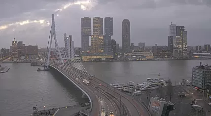 The sun breaks through the clouds as storm force winds sweep past Rotterdam. 6 Dec. 2024