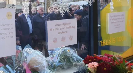 Prime Minister Dick Schoof and The Hague Mayor Jan van Zanen view a memorial for the victims of the Tarwekamp apartment building collapse that killed six and injured four. 8 December 2024