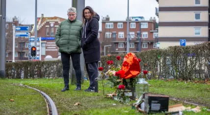 Mourners place flowers and balloons near fireworks debris where Jack, 14, died when a Cobra-6 firecracker exploded in his hands on Spanjaardstraat in Rotterdam. 1 Jan. 2025